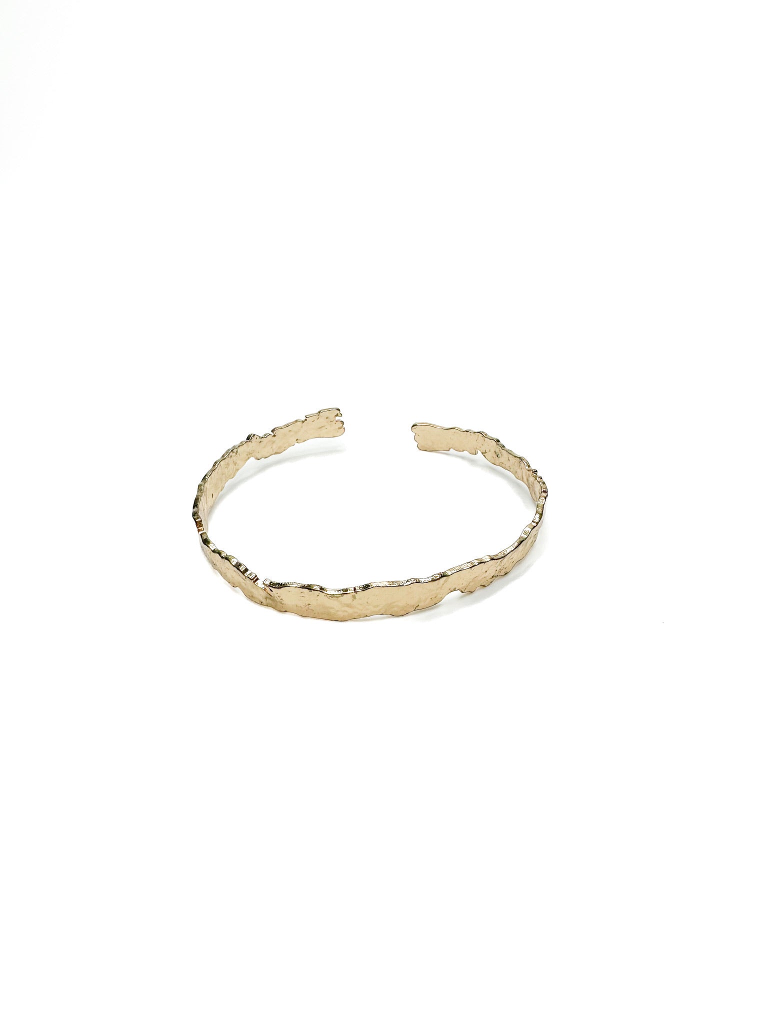 Gold bracelet on a white background