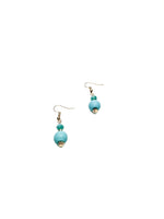 Turquoise beaded drop earrings with gold accents on a white background