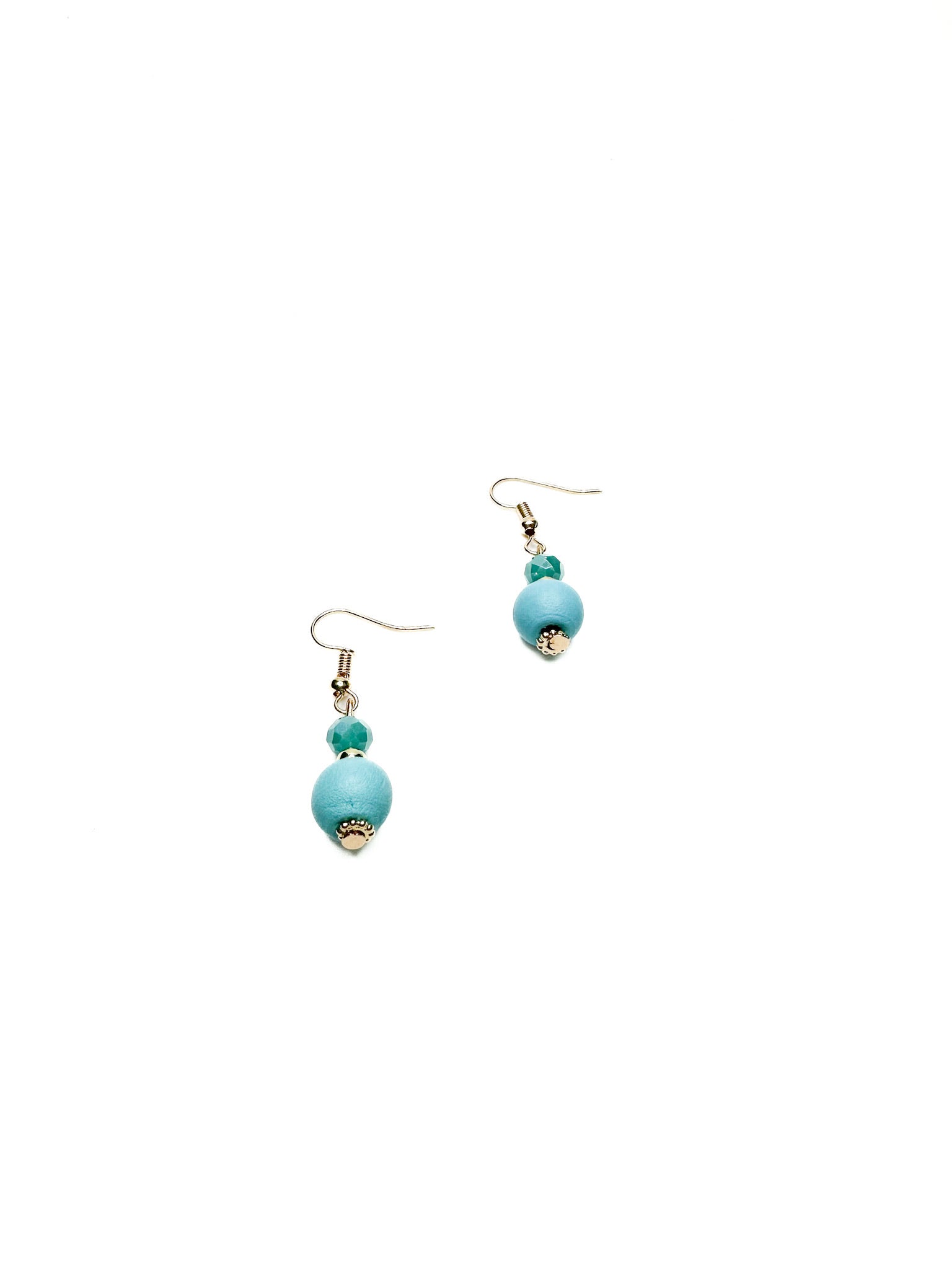 Turquoise beaded drop earrings with gold accents on a white background