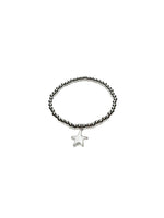 Bracelet with star charm on a white background