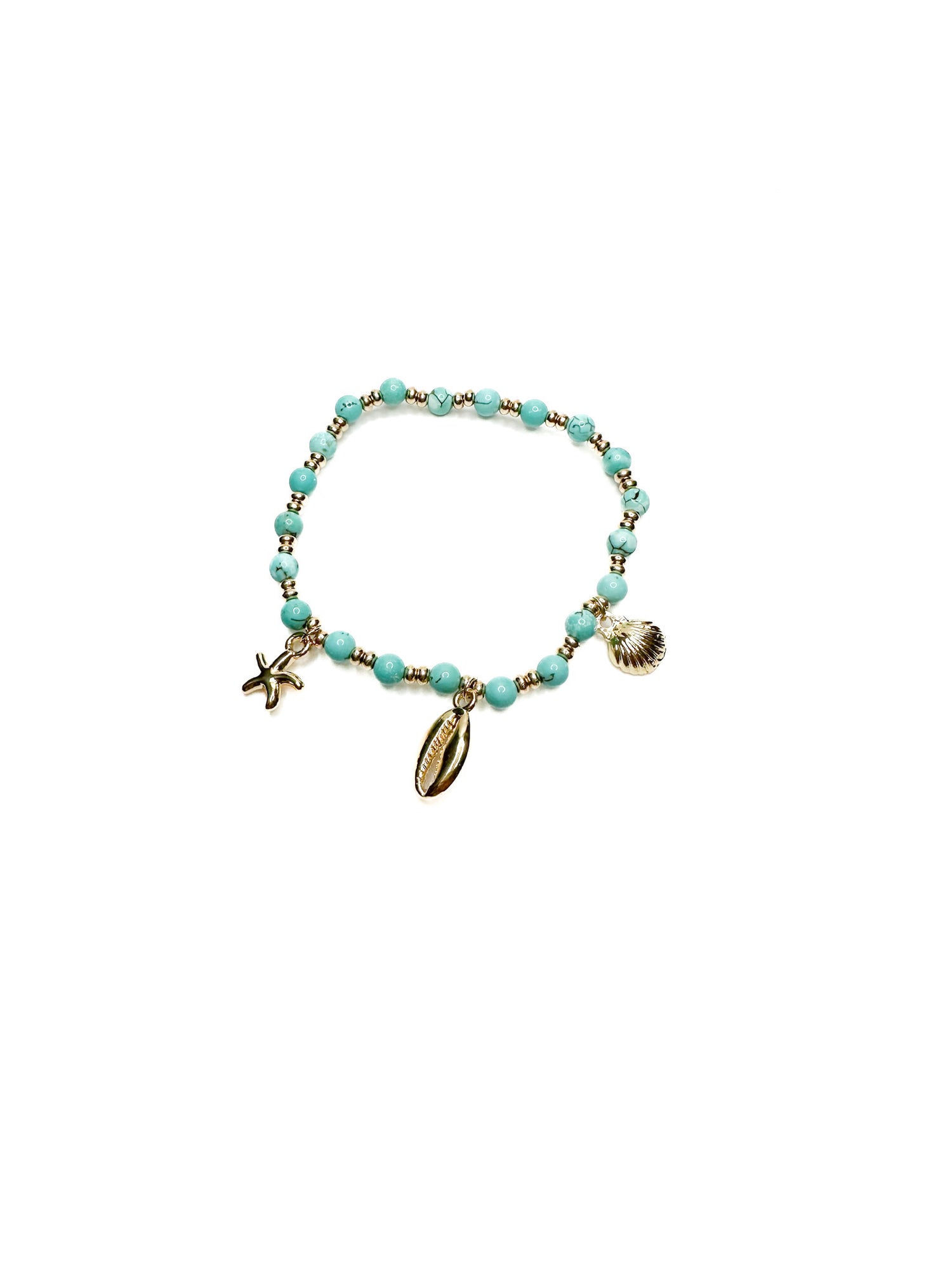 Turquoise beaded bracelet with gold charms on a white background