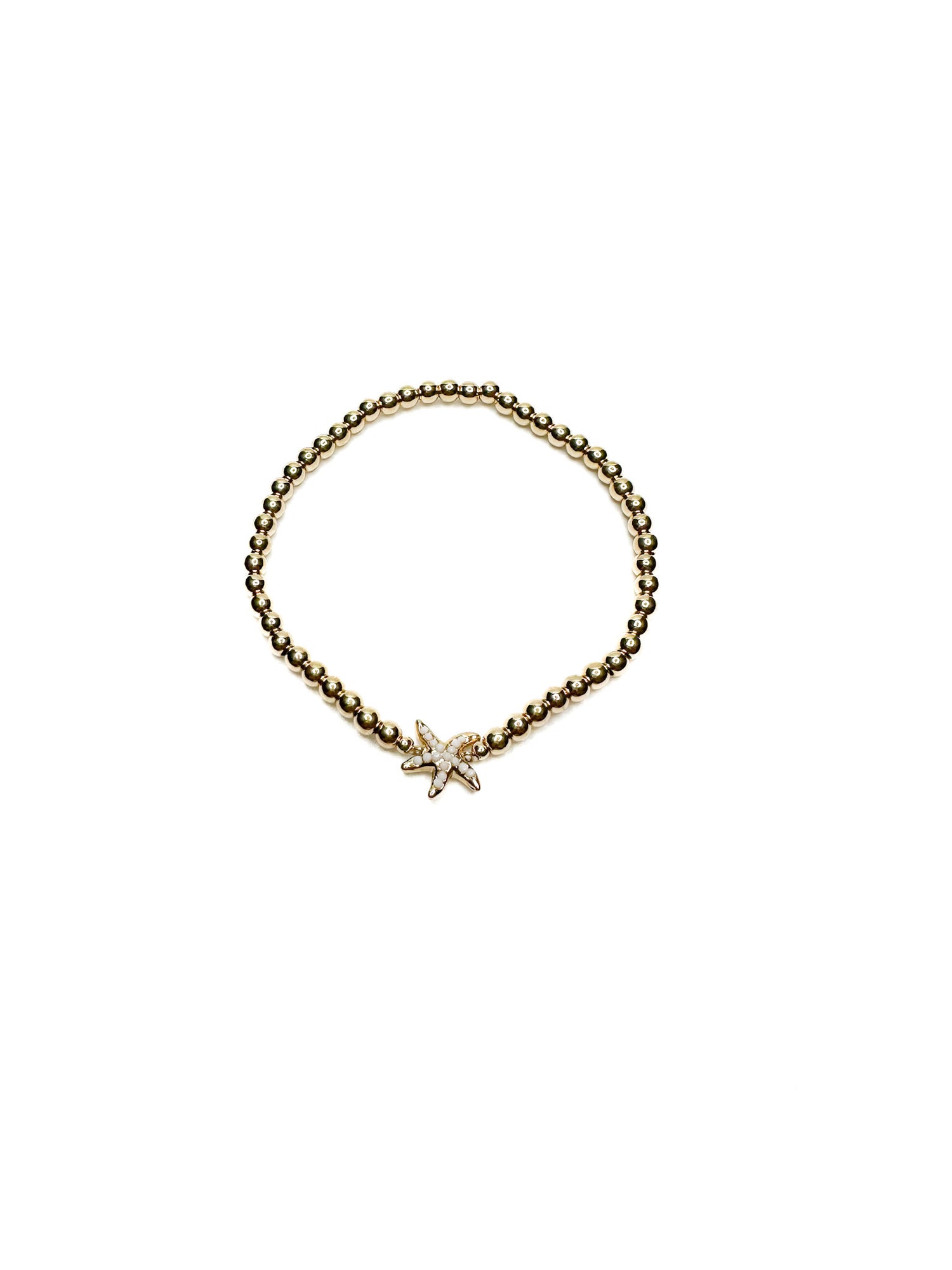 Gold bracelet with a star-shaped charm on a white background
