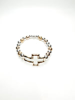Silver and gold beaded stretch bracelet with polished cross charm from Ardor Boutique