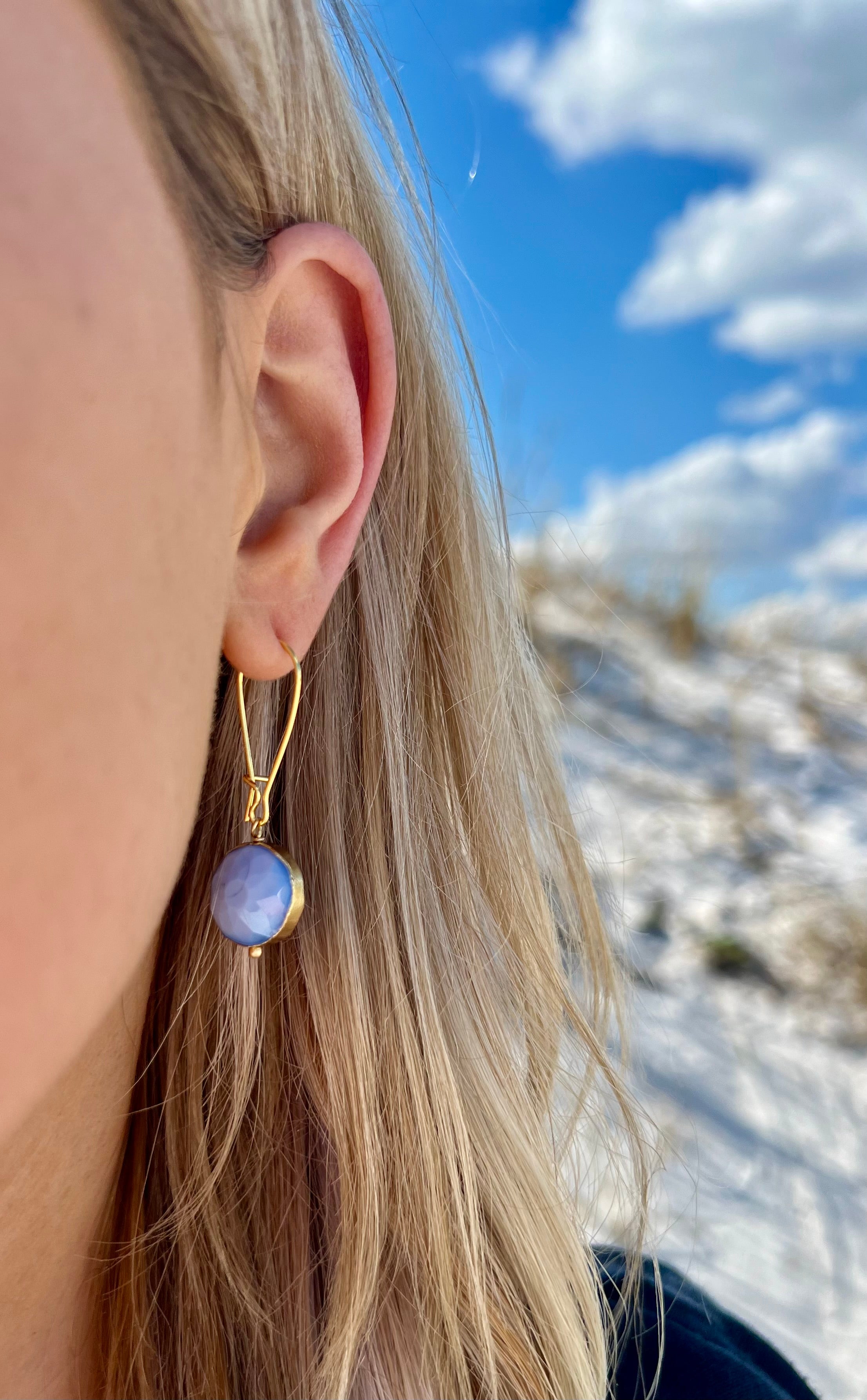Blue and gold handmade nickel free earrings circular shaped in ear 