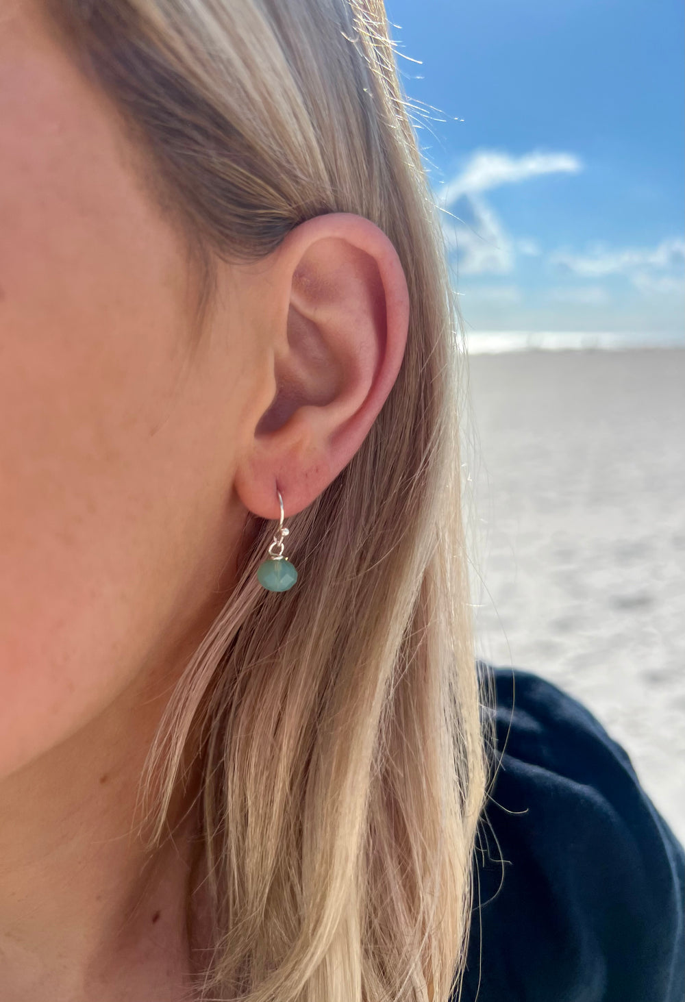 Cara Silver handmade earrings with aqua bead detail in ear
