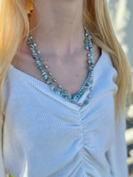 necklace featuring amazonite gemstones and freshwater pearls being worn