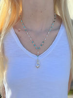 Close-up of Sofia Biwa Pearl and Amazonite Necklace on model, Y-shaped chain with Biwa pearl drop, worn with a white V-neck tank top.
