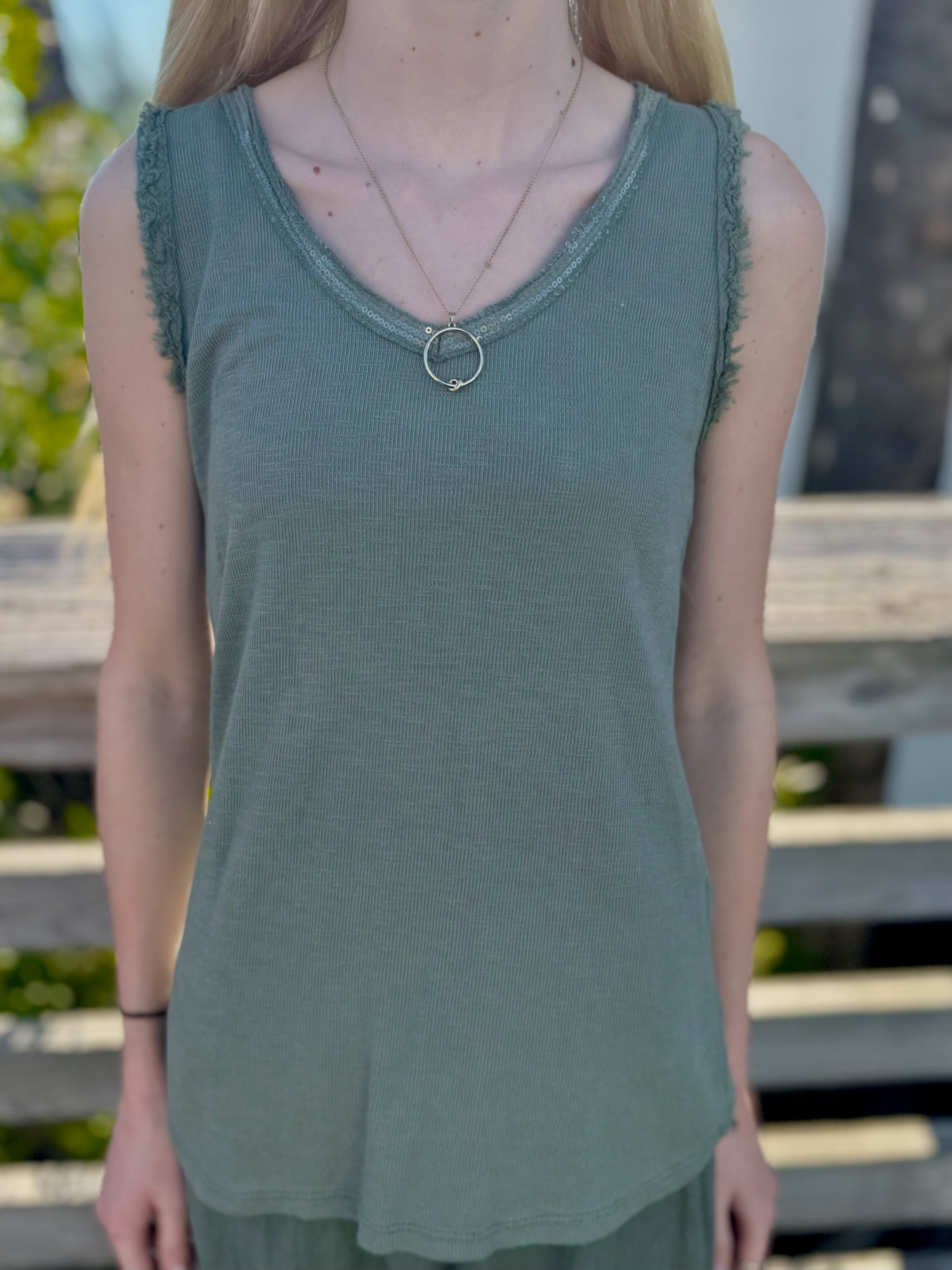 Front view of the Elisa Sequin Tank in olive, with sequined v-neckline styled with a simple gold necklace.