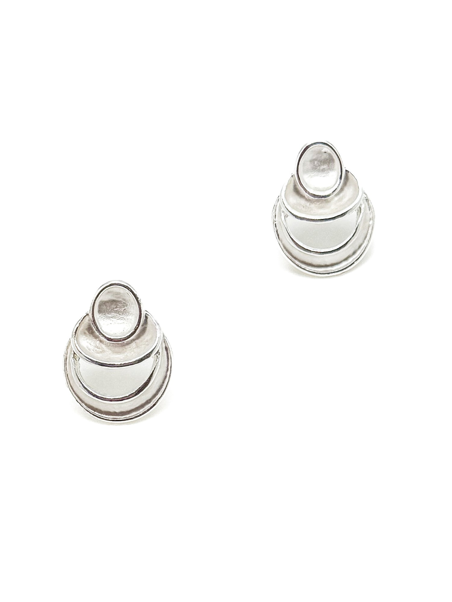 Pair of silver earrings on a white background