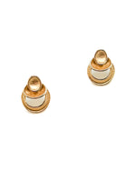 Pair of gold and white earrings on a white background