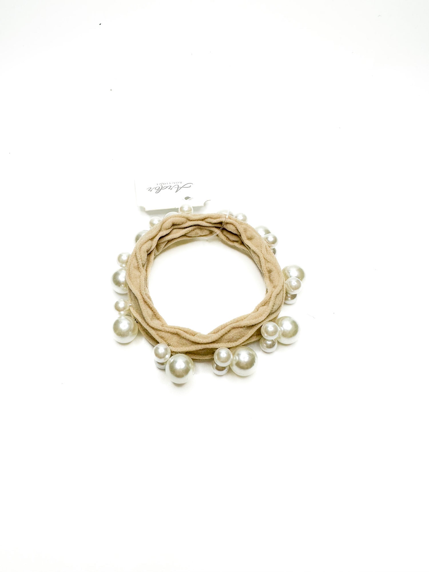 Beige wreath with pearls on a white background