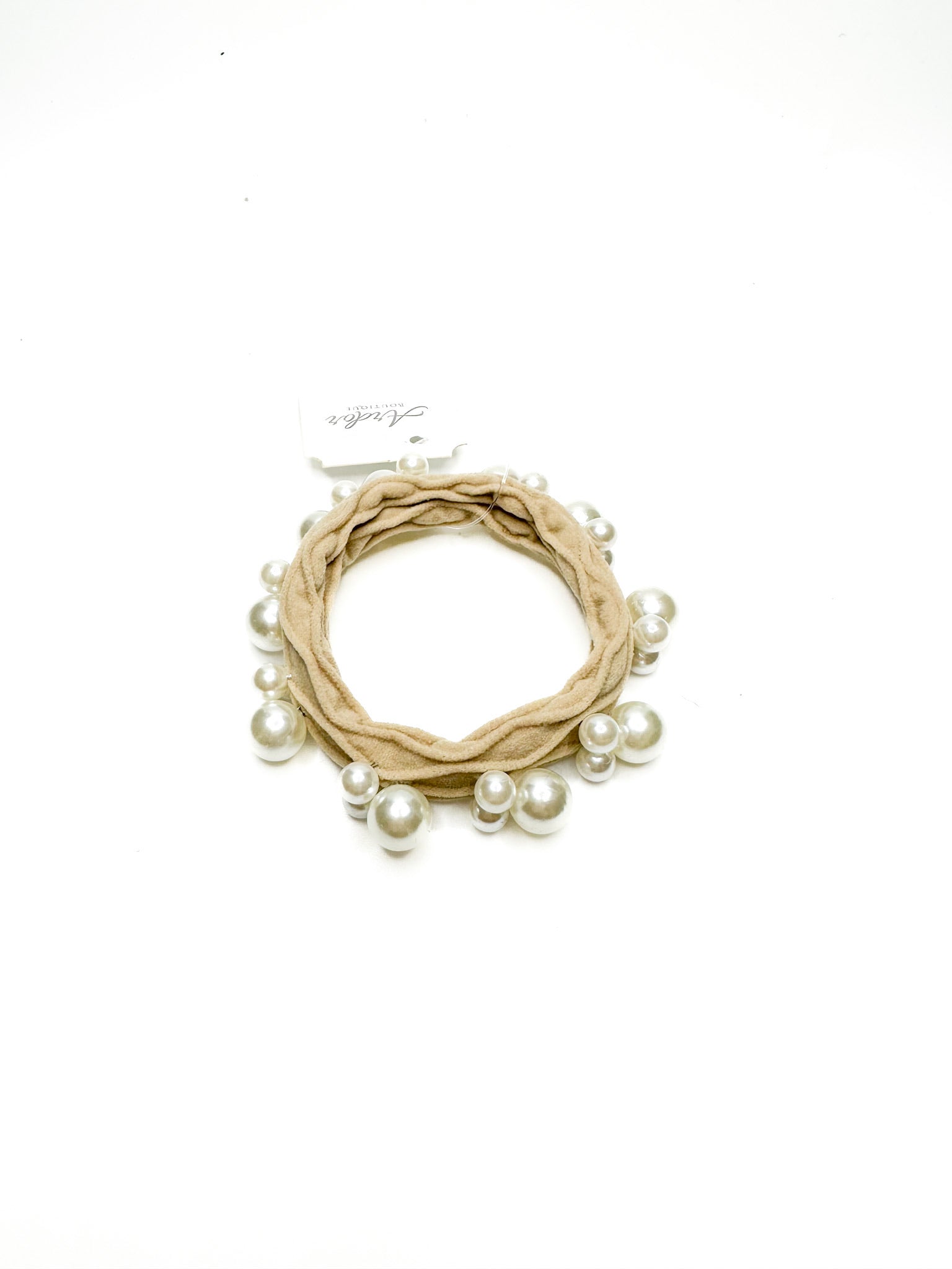 Beige wreath with pearls on a white background
