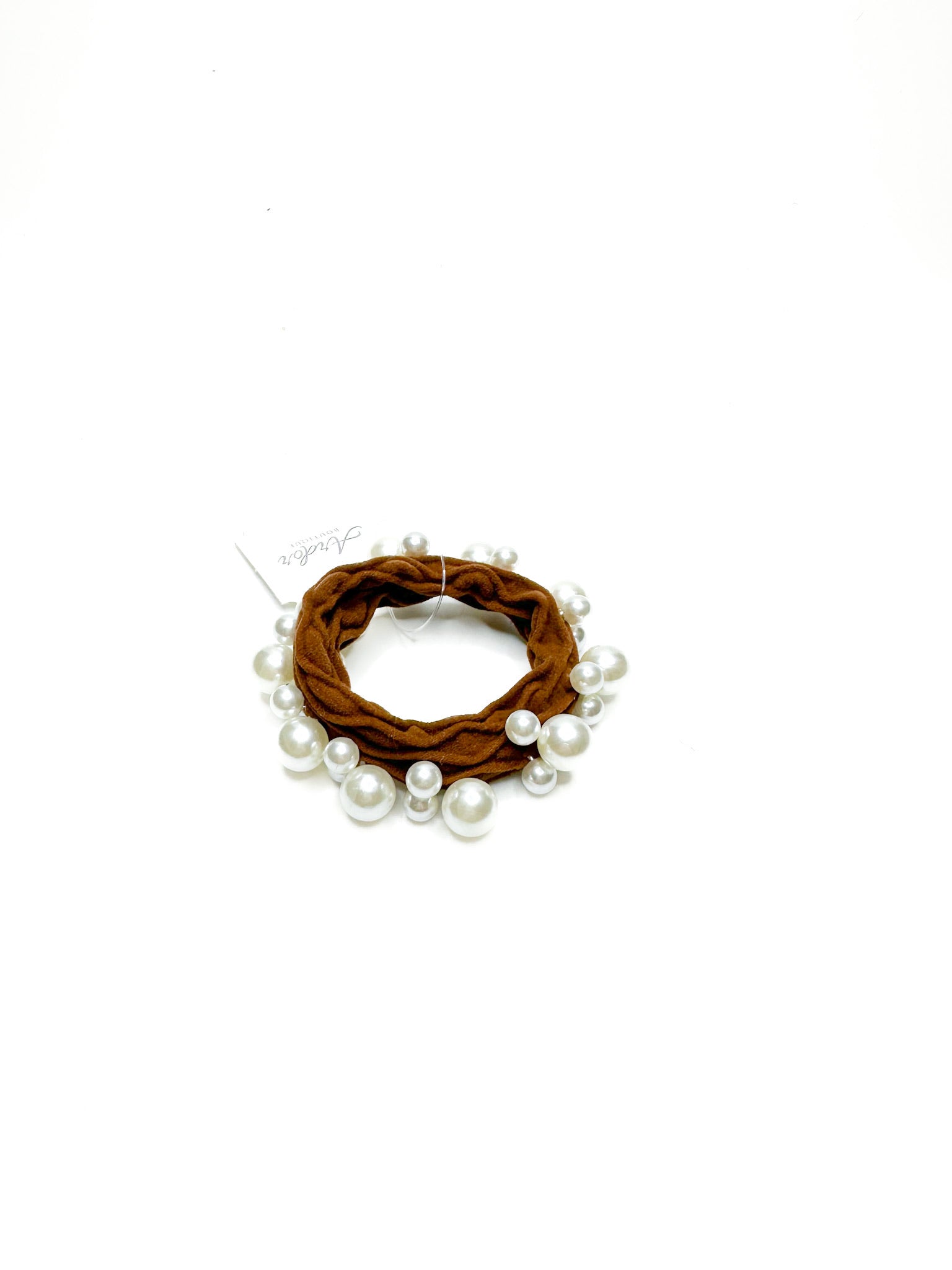Brown scrunchie with pearls on a white background