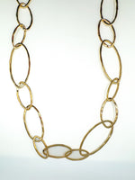 Gold chain necklace on a white background