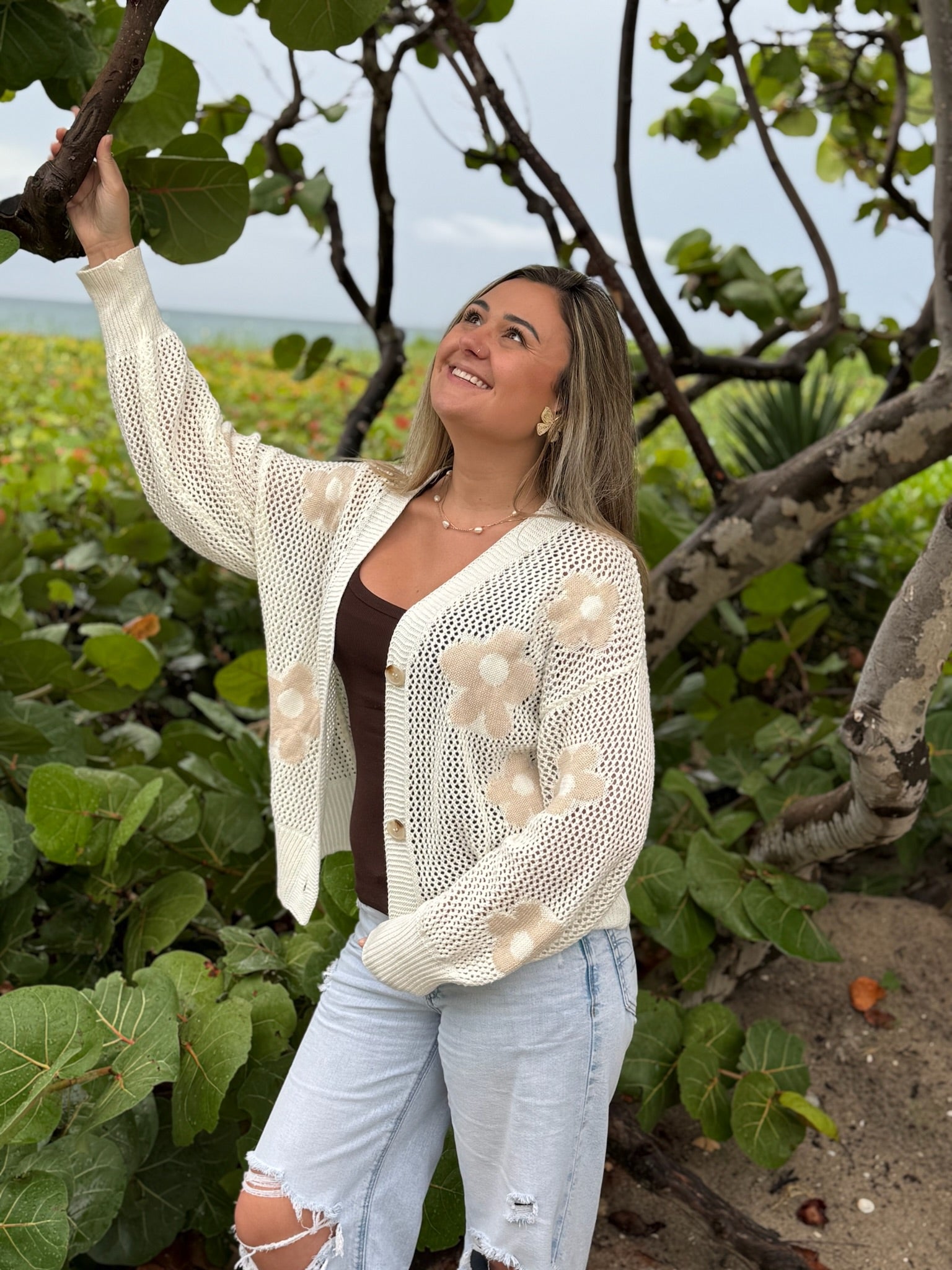 Paislee Pearl Necklace featuring delicate spaced pearls on a gold-tone chain, styled with an ivory floral cardigan, Ardor Boutique.