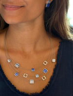 triple-layer necklace with square accents in cool blues with metallic open frames