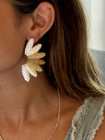beige fan shaped nickel free earring on model 