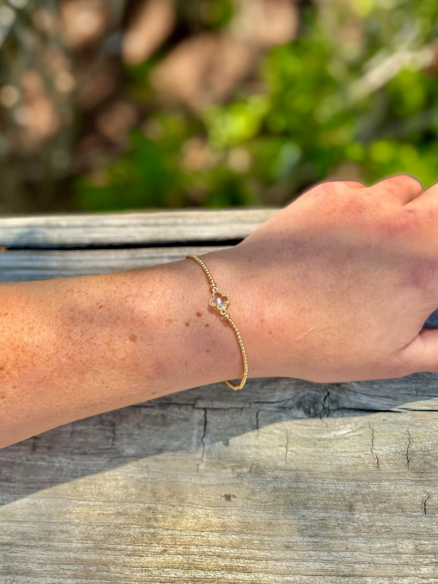 gold beaded charm bracelet