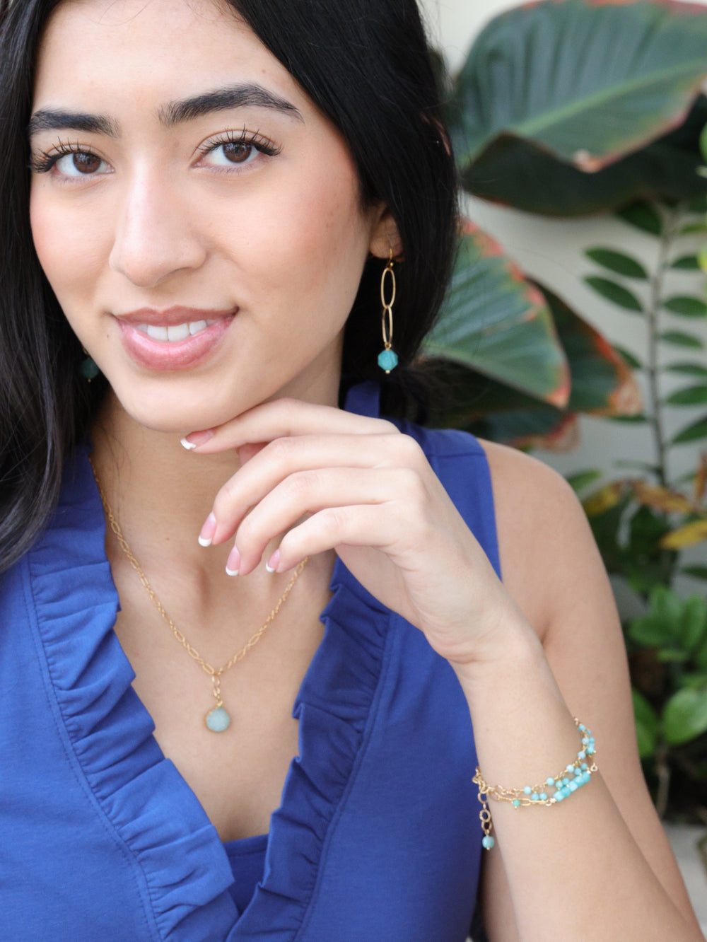 model wearing druzy necklace paired with other pieces from the nh Aqua Gold collection 