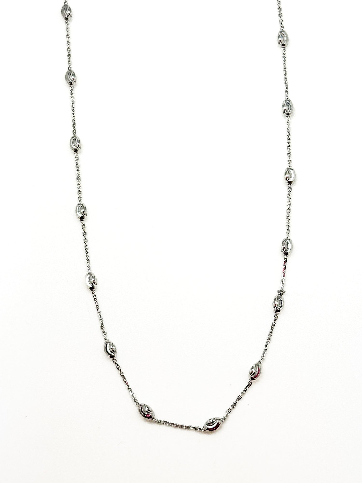 Silver chain necklace on a white background