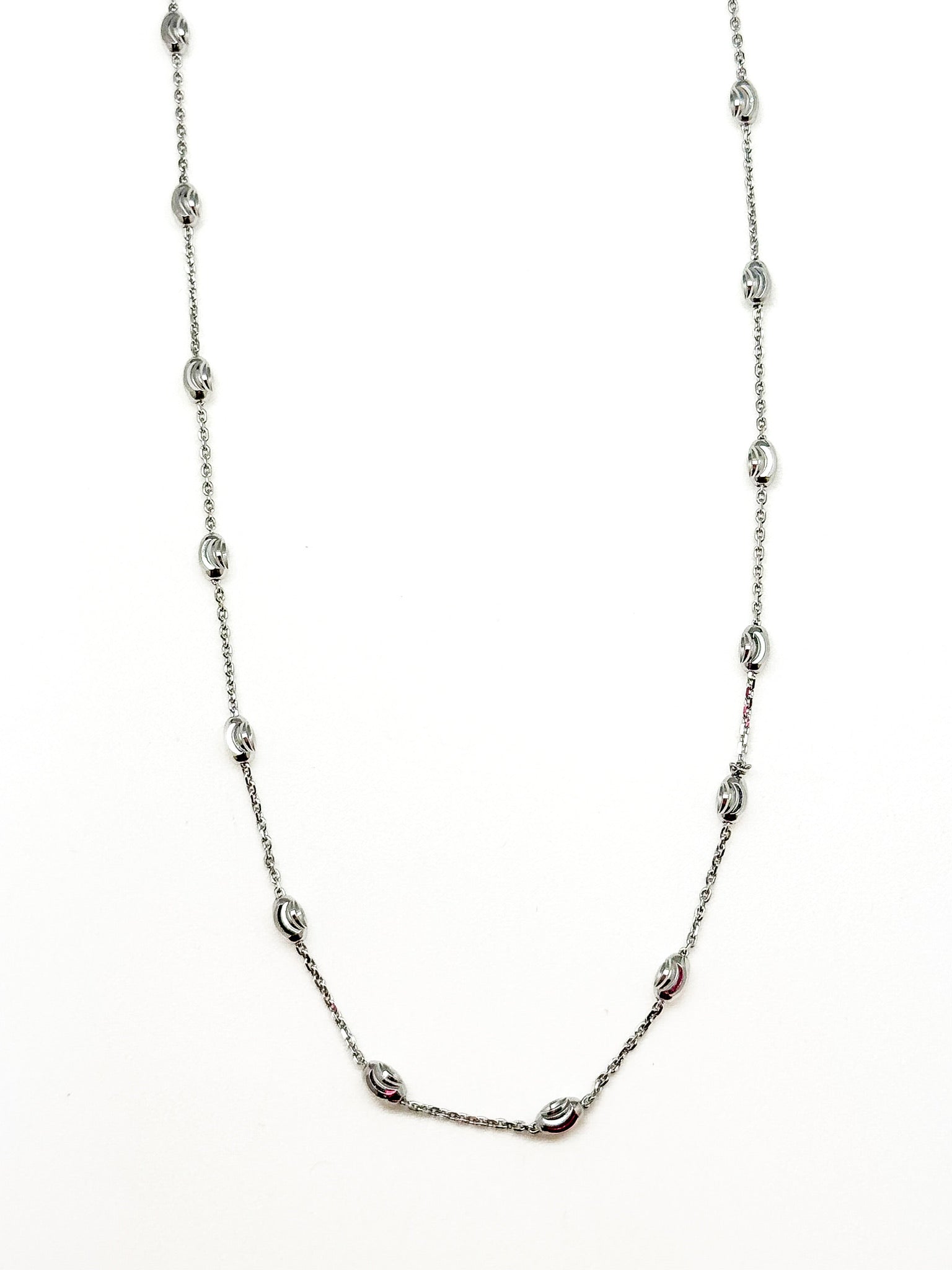 Silver chain necklace on a white background