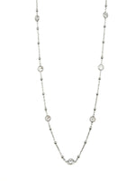 Silver necklace with small beads on a white background