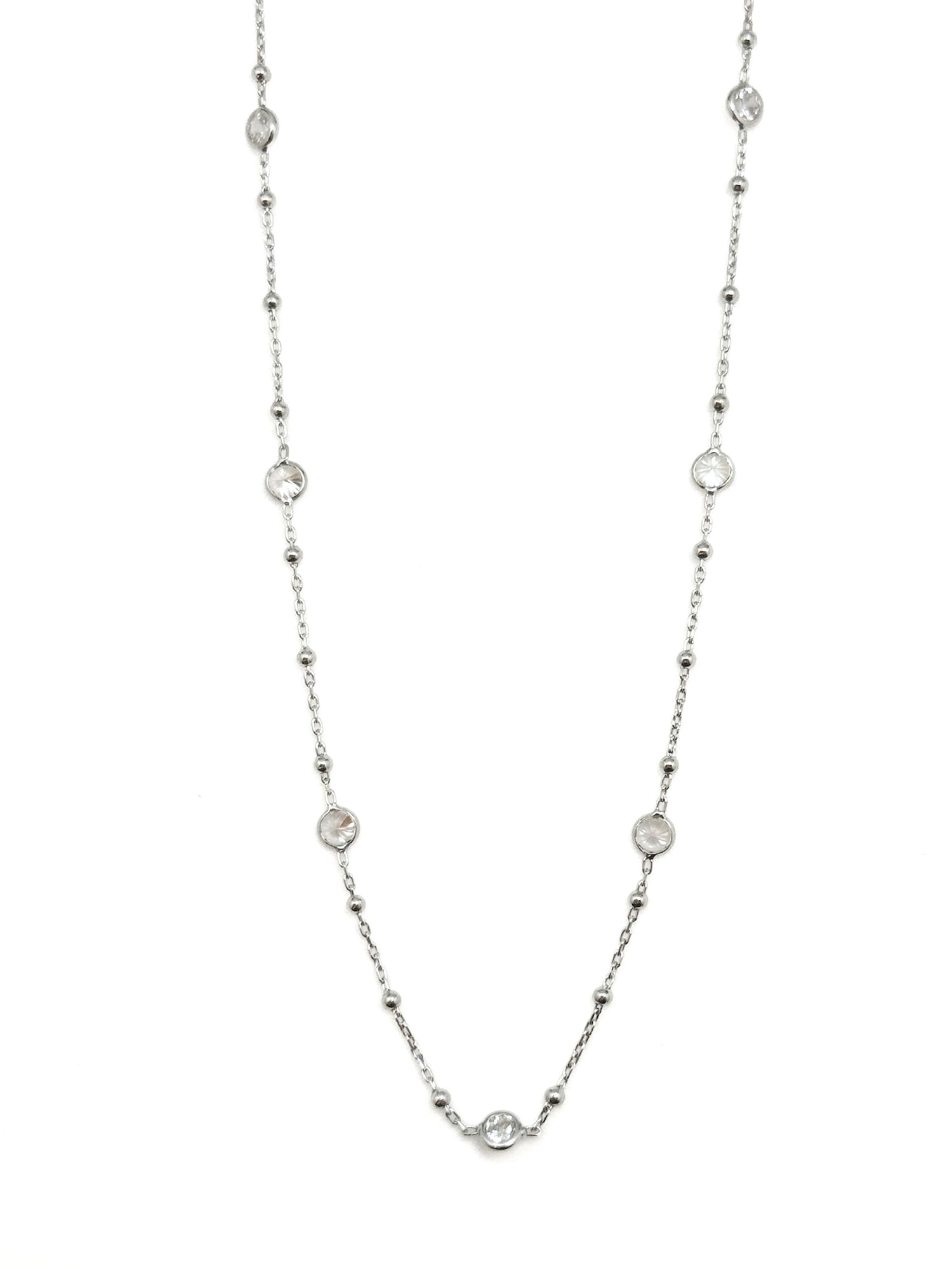 Silver necklace with small beads on a white background