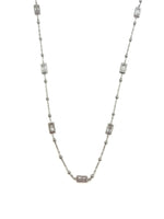Silver necklace with rectangular beads on a white background