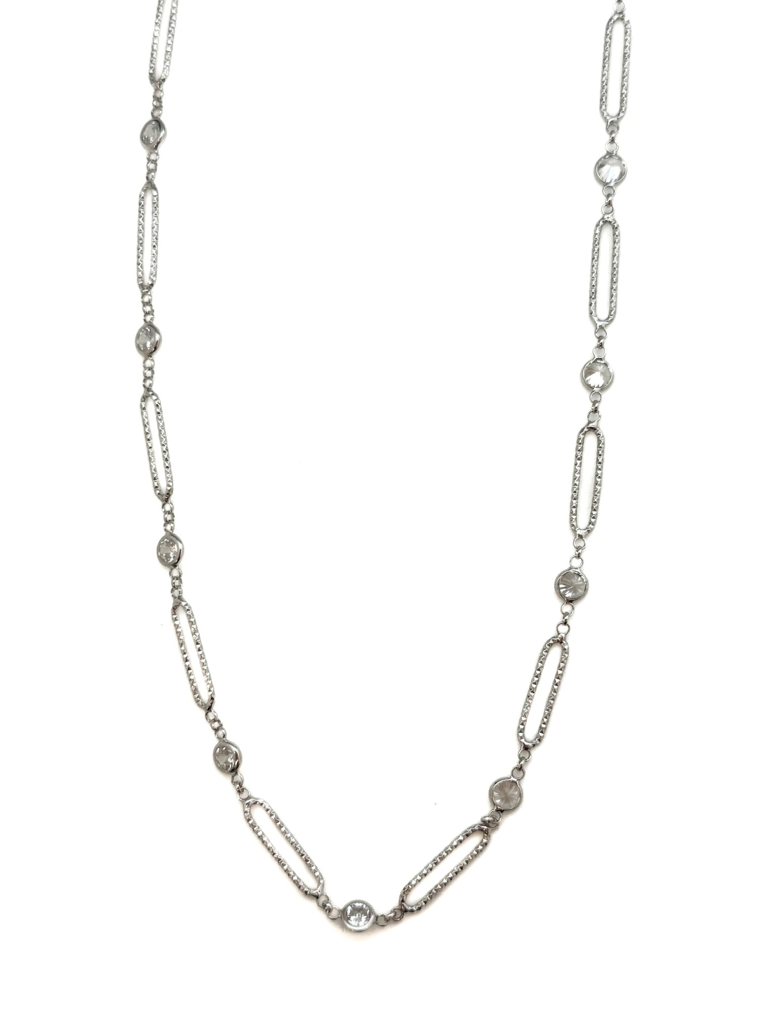 Silver chain necklace with small diamonds on a white background