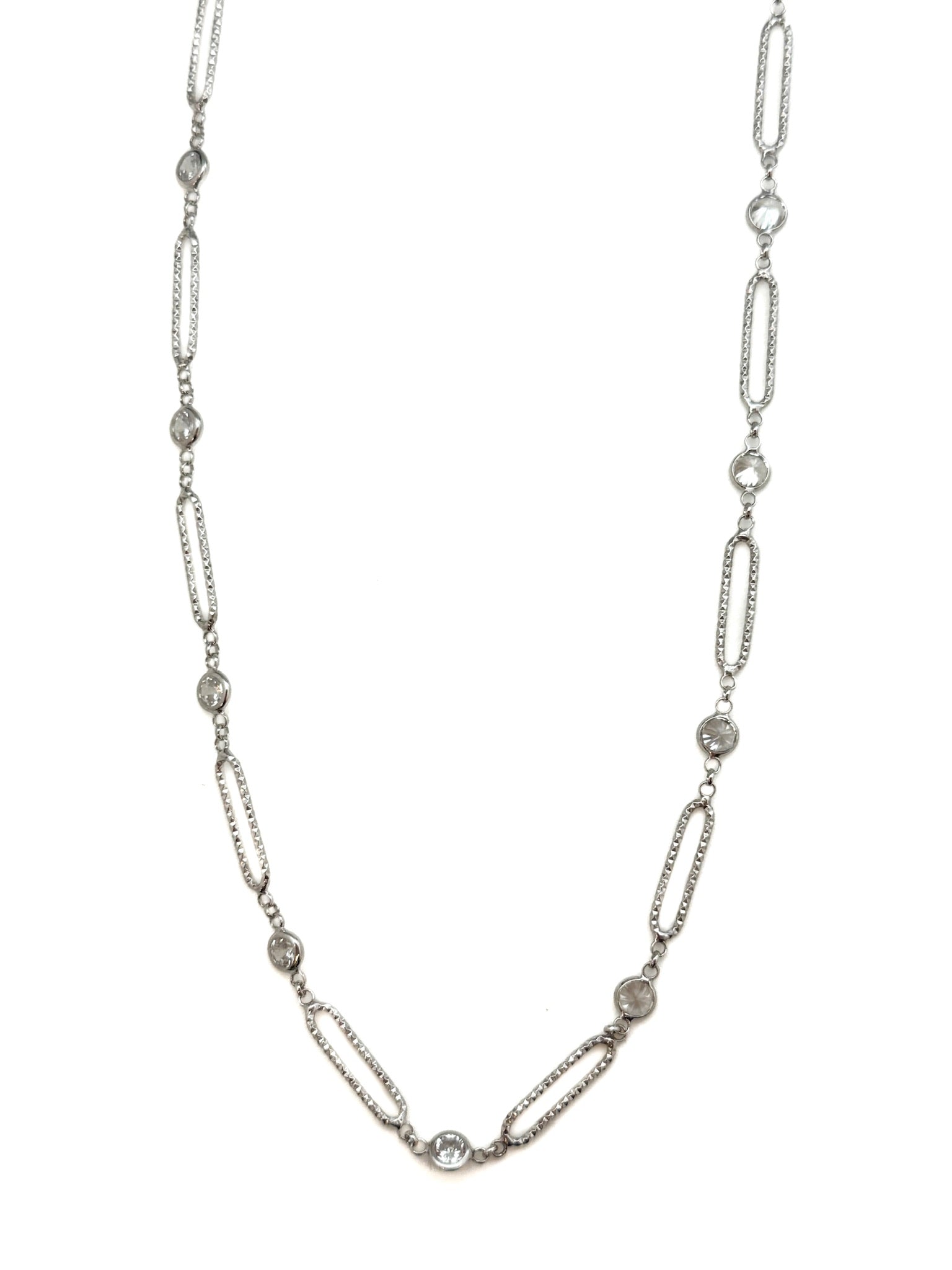 Silver chain necklace with small diamonds on a white background