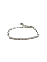 Silver bracelet with small stones on a white background