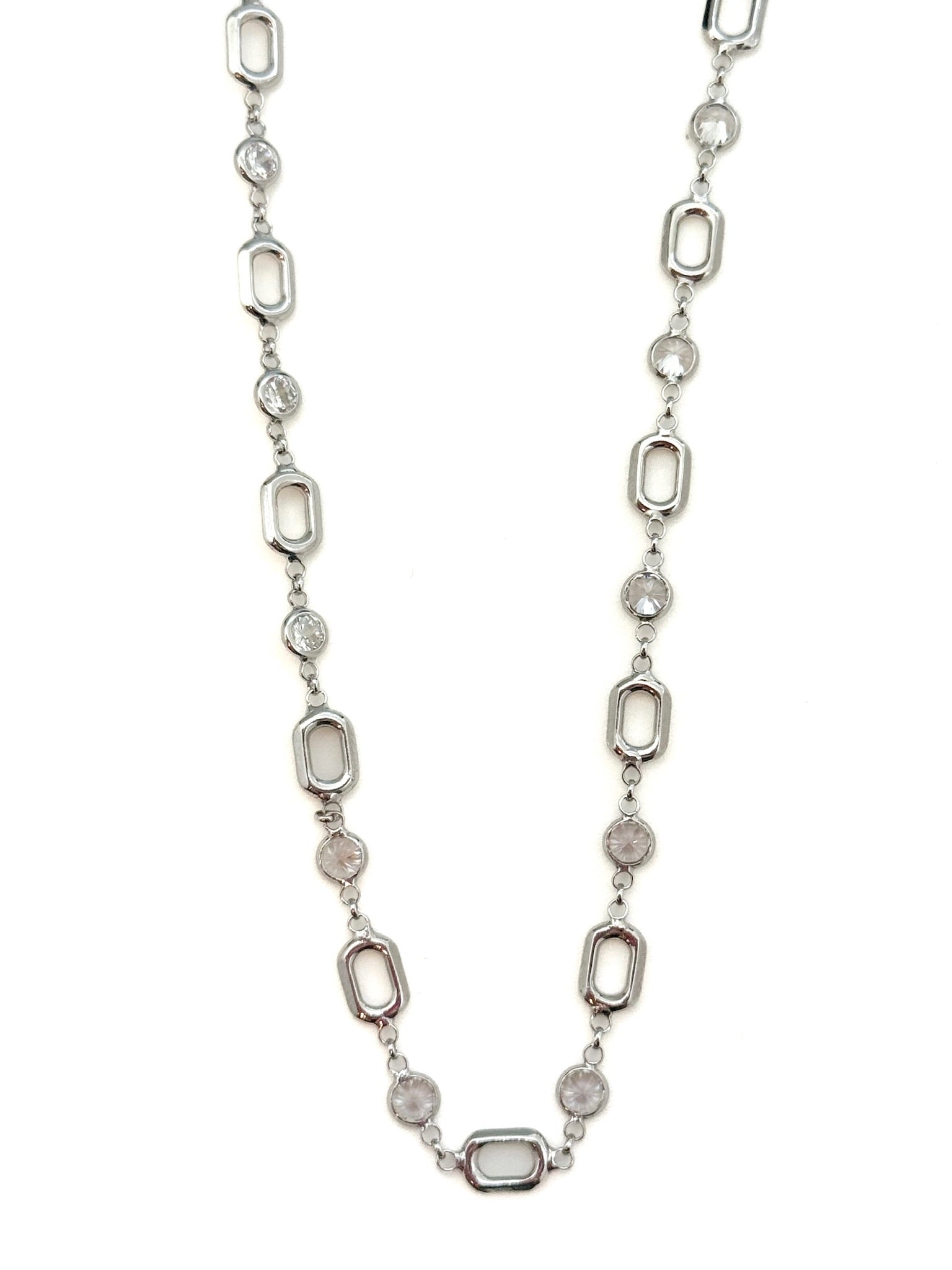 Silver necklace with oval-shaped beads on a white background
