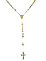 Gold necklace with beads and a cross pendant on a white background