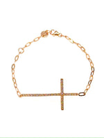 Rose gold bracelet with a cross charm on a white background