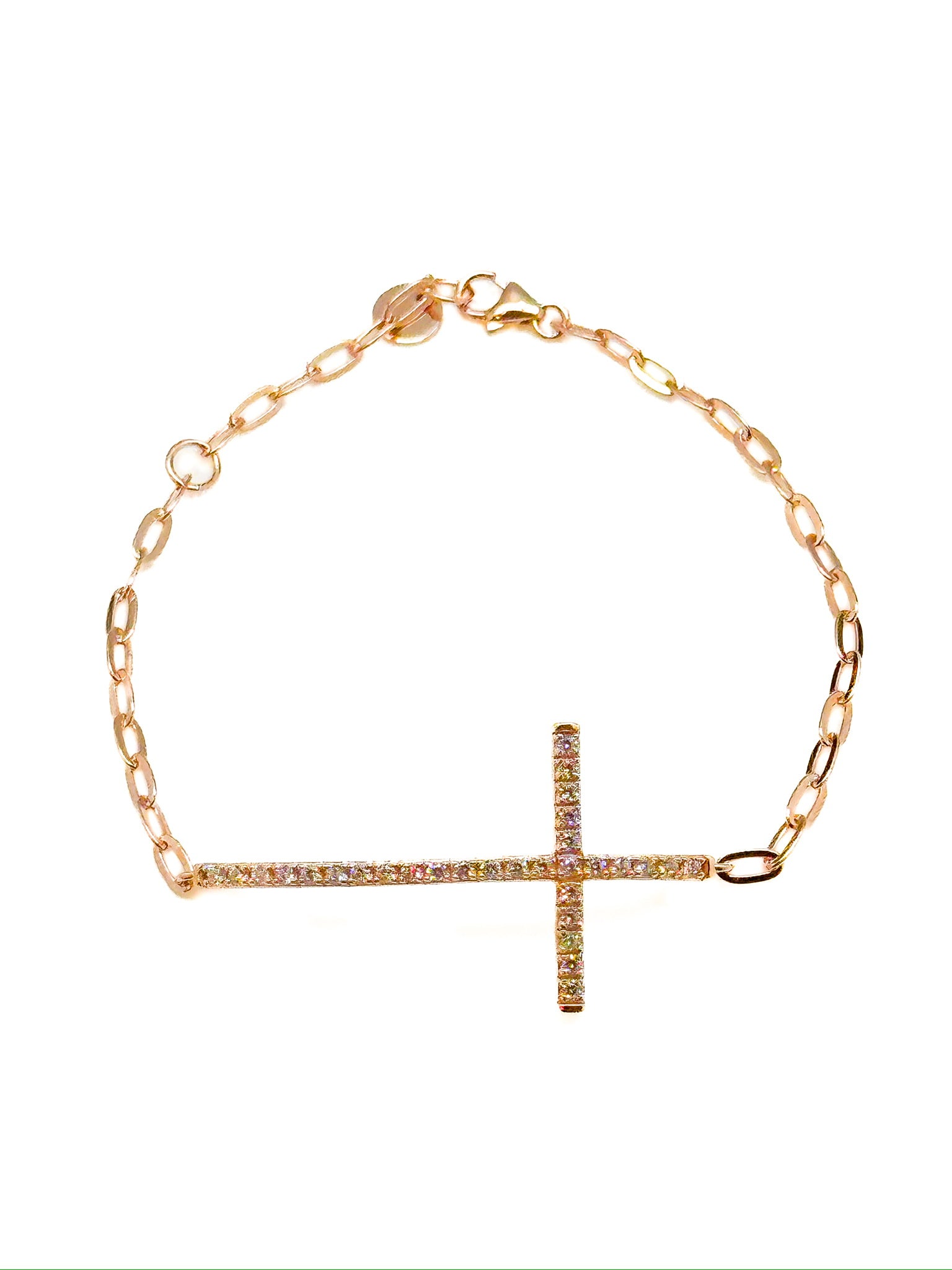 Rose gold bracelet with a cross charm on a white background