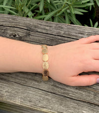 Amber bracelet in gold on model 