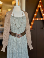Brown open-knit cardigan with a relaxed open front, diamond knit pattern and wide ribbed cuffs at Ardor Boutique.