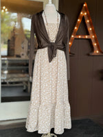 Beige floral maxi dress styled with a lightweight chocolate brown tie-front cardigan and long necklace at Ardor Boutique.