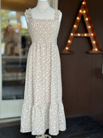 Beige floral maxi dress with a smocked bodice, square neckline, ruffle straps and a flowing skirt at Ardor Boutique.