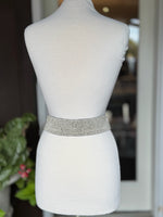 Back view of ivory beaded stretch waist belt showing the wide flexible multi-row bead design at Ardor Boutique.
