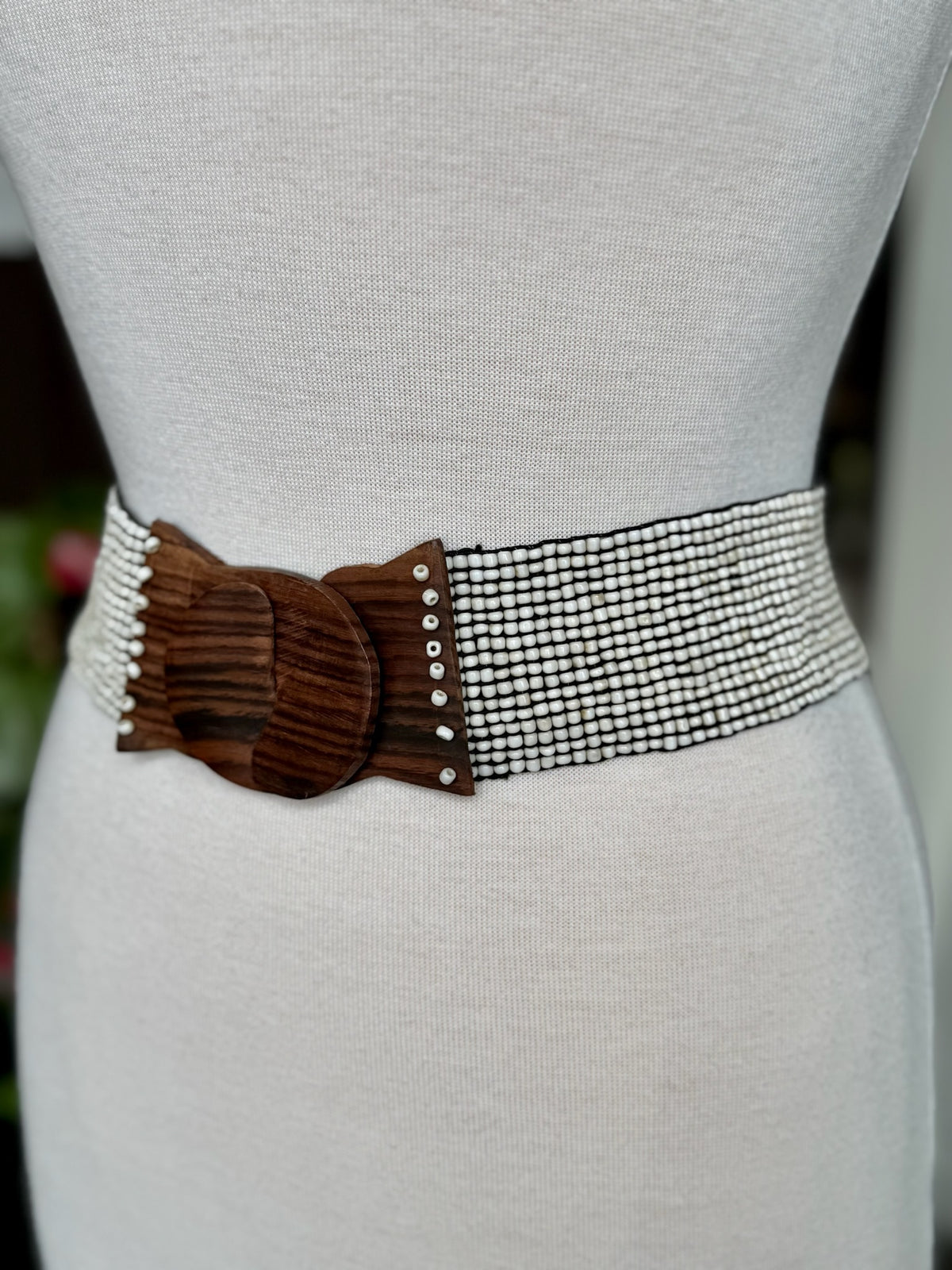 Back view of ivory beaded stretch waist belt showing the wide flexible multi-row bead design at Ardor Boutique.

