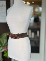 Brown beaded stretch waist belt with oversized wood-look buckle displayed on mannequin at Ardor Boutique.