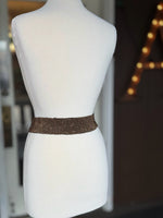 Back view of brown beaded stretch belt showing the flexible multi-row beaded band at Ardor Boutique.