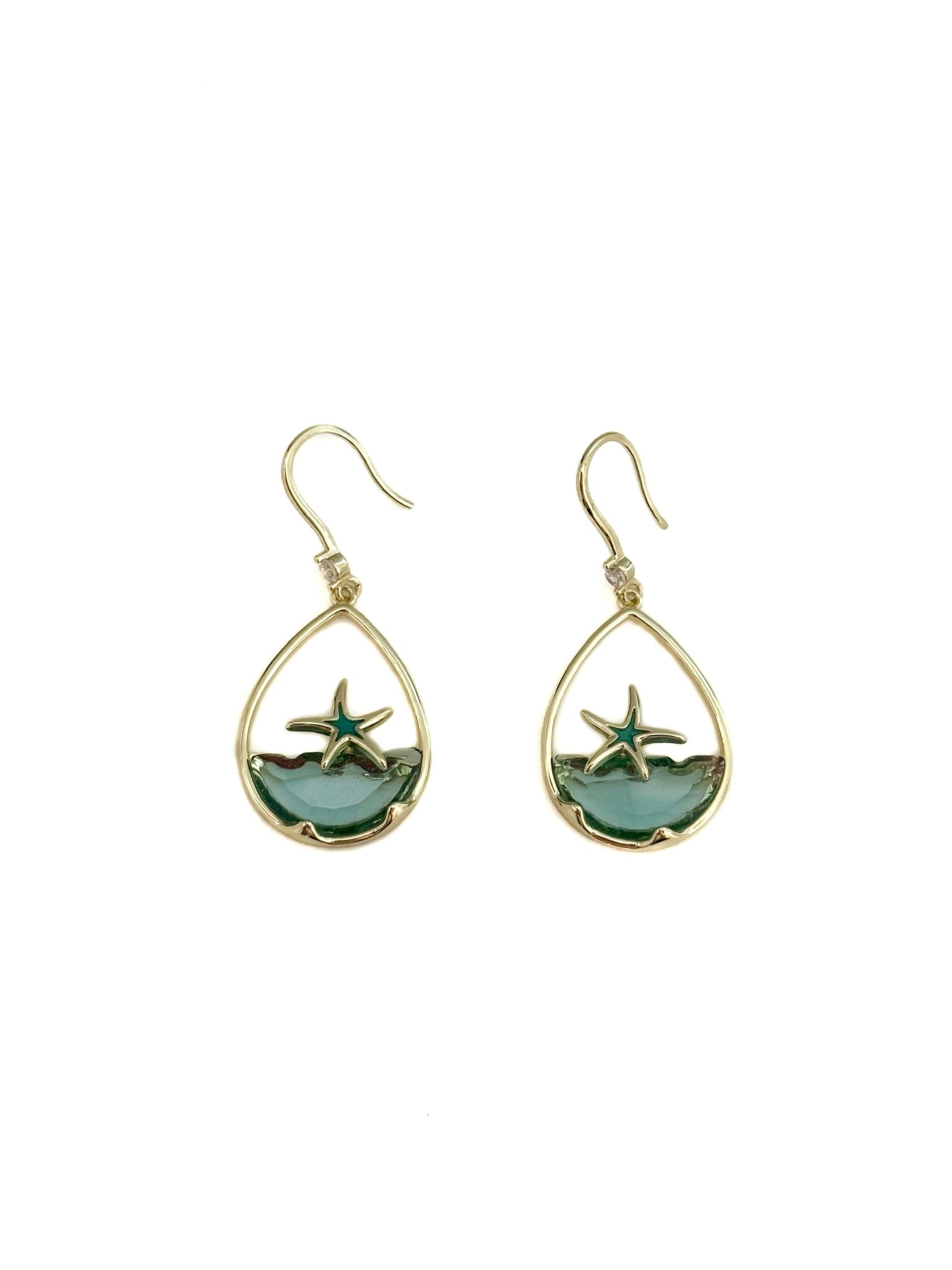 Teardrop-shaped earrings with starfish design on a white background