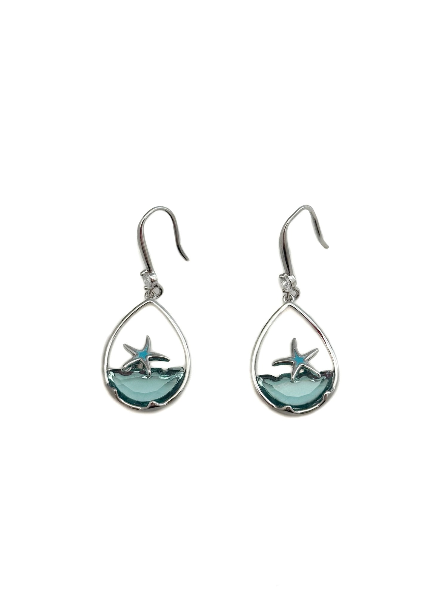 Teardrop-shaped earrings with starfish design on a white background