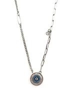 Necklace with a circular pendant featuring an eye design on a white background