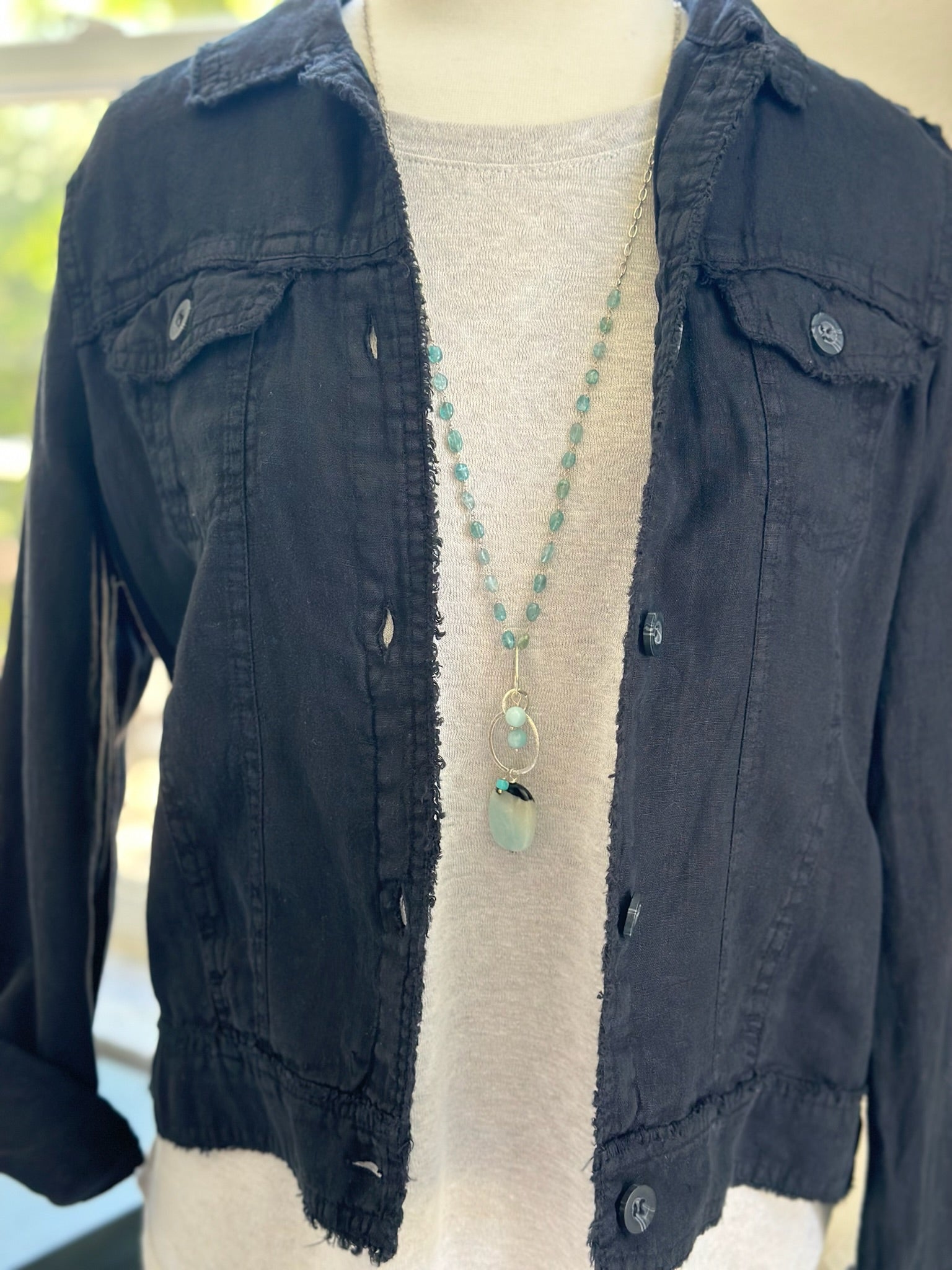 trina top styled with linen jacket and handmade necklace