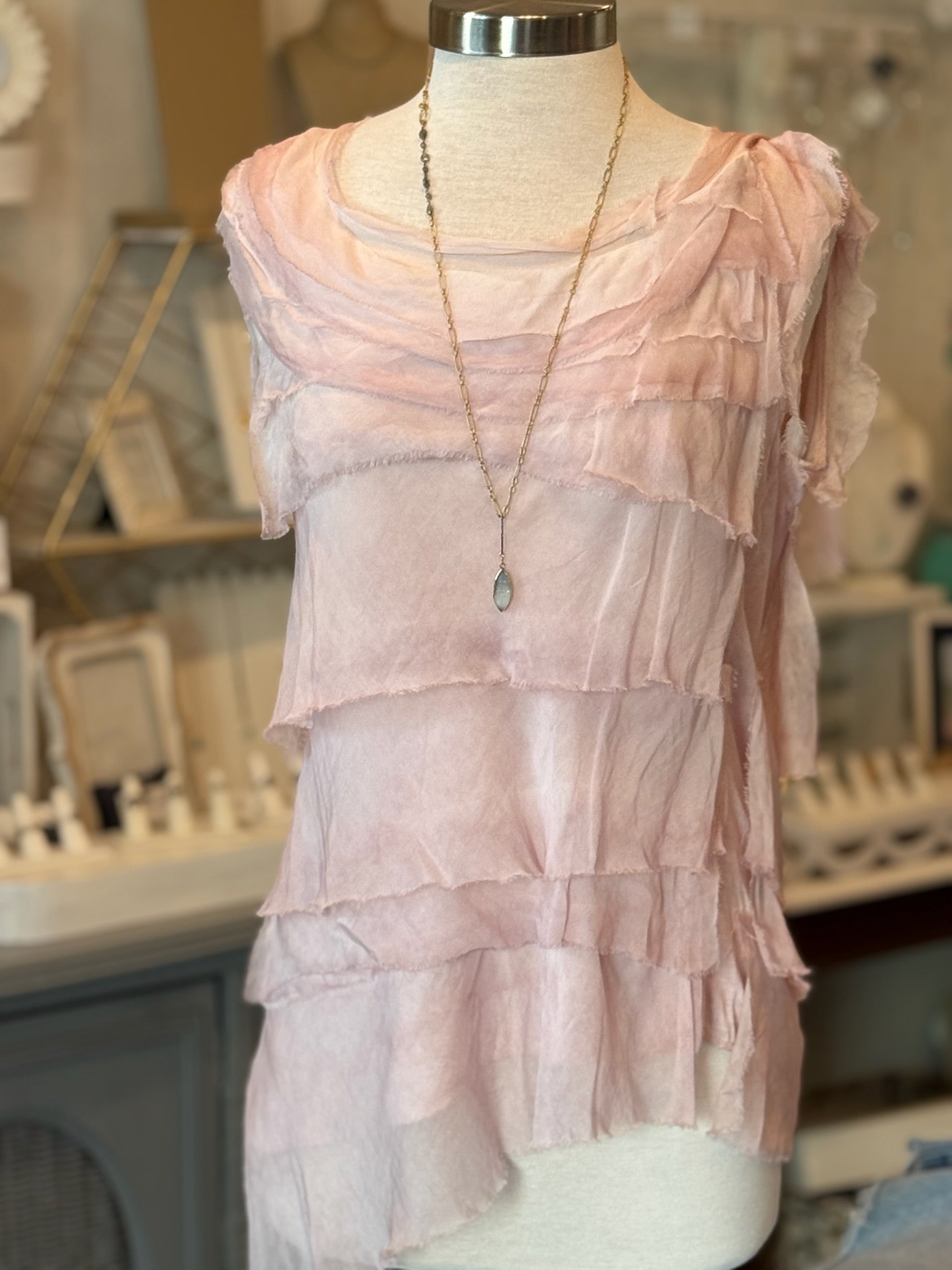 pink symmetrical ruffle top