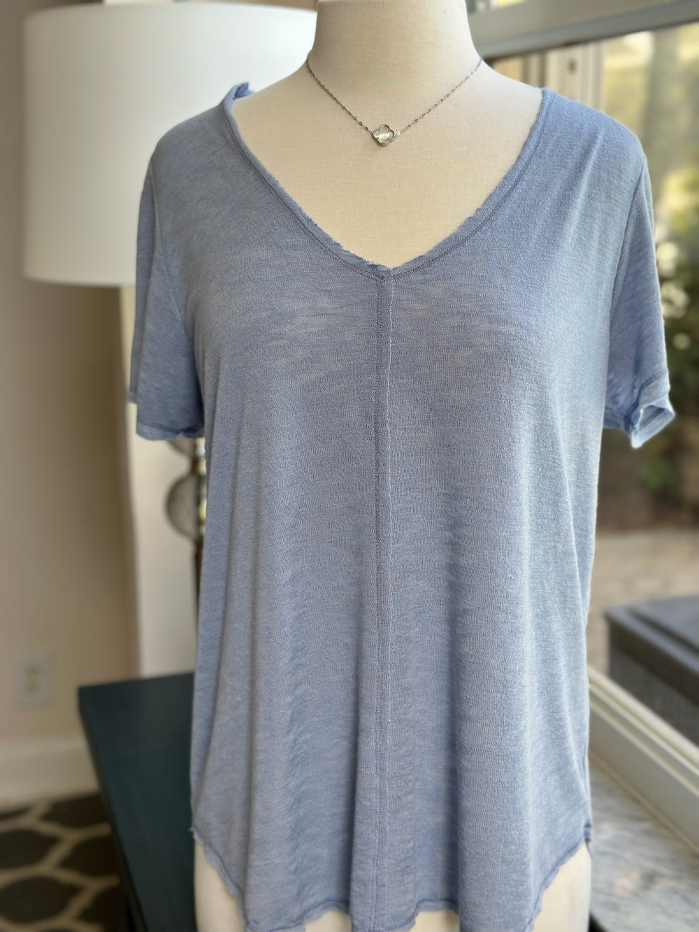Valerie top in periwinkle styled on mannequin 