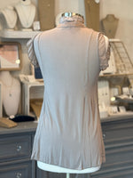 back of sleeveless taupe blouse
